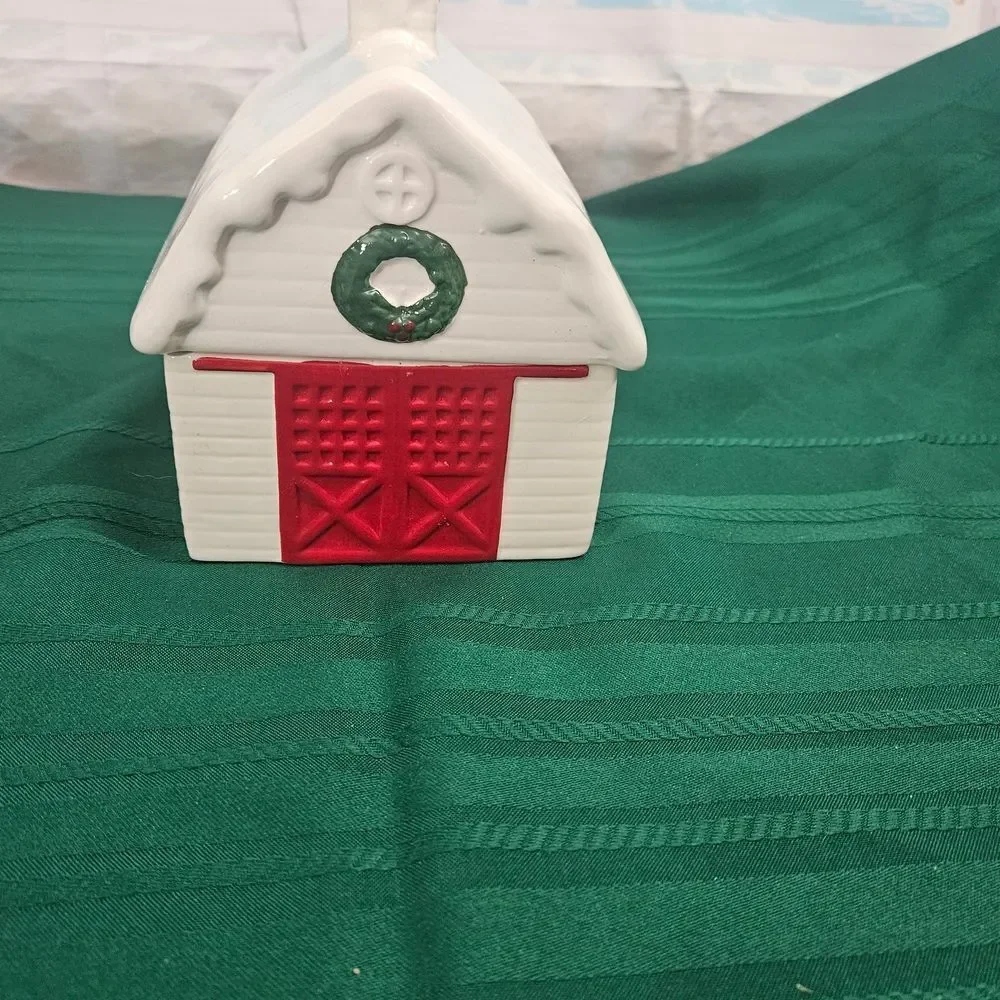 Cookie And Treat Jar In A Ceramic Barn with Red Doors And Green Wreath